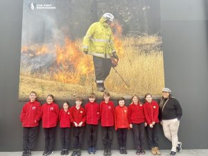 Aimee Chan with students of Bethanga Primary at viewing her installation Our First Responders in Wodonga as part of Regional Arts Victoria Student Voices in Recovery